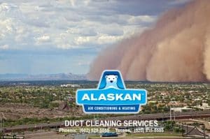 Dust storm coming over a city with Alaskan logo over bottom of image
